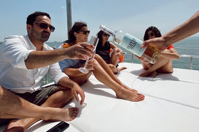 2H Lisbon Private Luxury Catamaran Tour with Welcome Drink - Cristo Rei From the Front Side: A Monumental Contrast