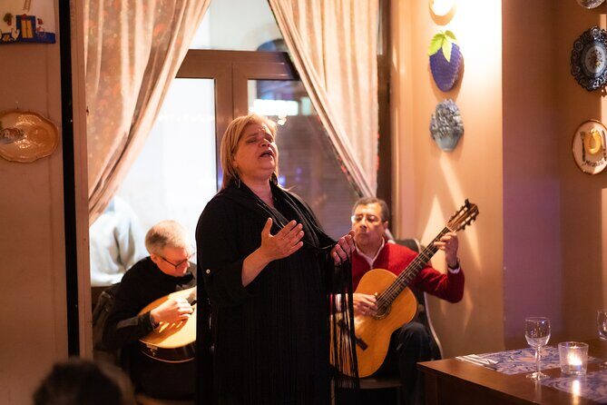 Fado Musical Experience with Portuguese Wine & Appetizers - Meeting at Largo do Chafariz de Dentro and the Yellow Umbrella moment