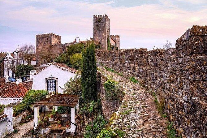 Fátima Batalha Nazaré and Óbidos Full Day Tour from Lisbon - Stop 2: Batalha Monastery for Gothic drama and UNESCO weight