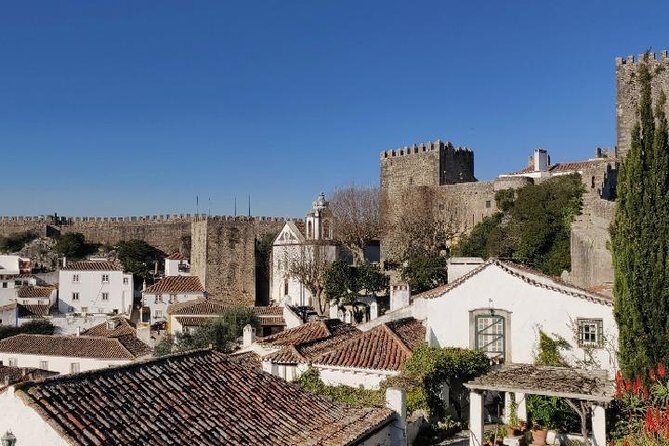 Fátima Batalha Nazaré and Óbidos Full Day Tour from Lisbon - Stop 4: Óbidos medieval walls, ramparts, and the ginjinha ritual