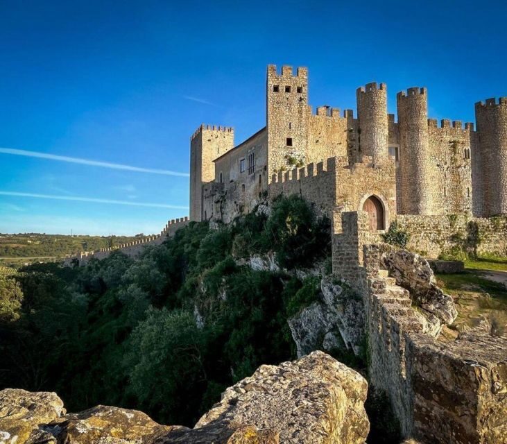 Fátima, Nazaré & Óbidos: A Scenic Day Trip from Lisbon - Óbidos: medieval walls, sunset timing, and the ginjinha chocolate cup