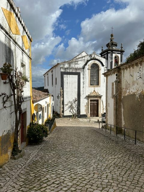 From Fátima: Batalha, Nazaré, and Óbidos Full-Day Tour - Nazaré cliffs and the Sítio district: where views steal the show