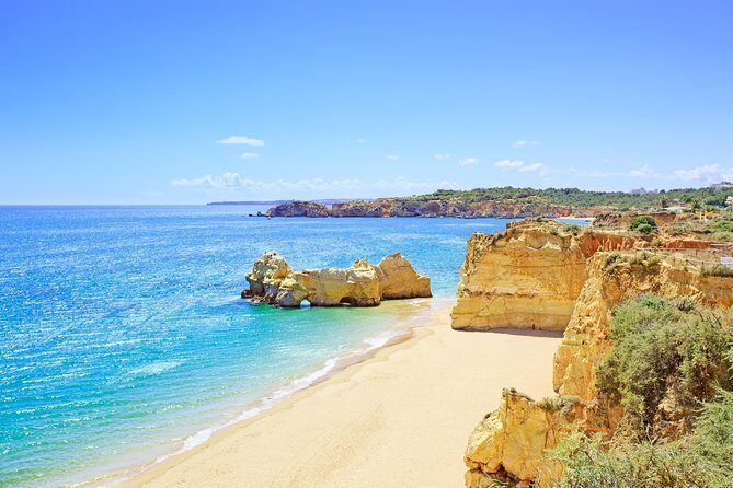 From Lisbon: Algarve Private Tour to Portimao, Lagos and Sagres - Praia da Marinha: clear water, famous cliffs, and a calm break