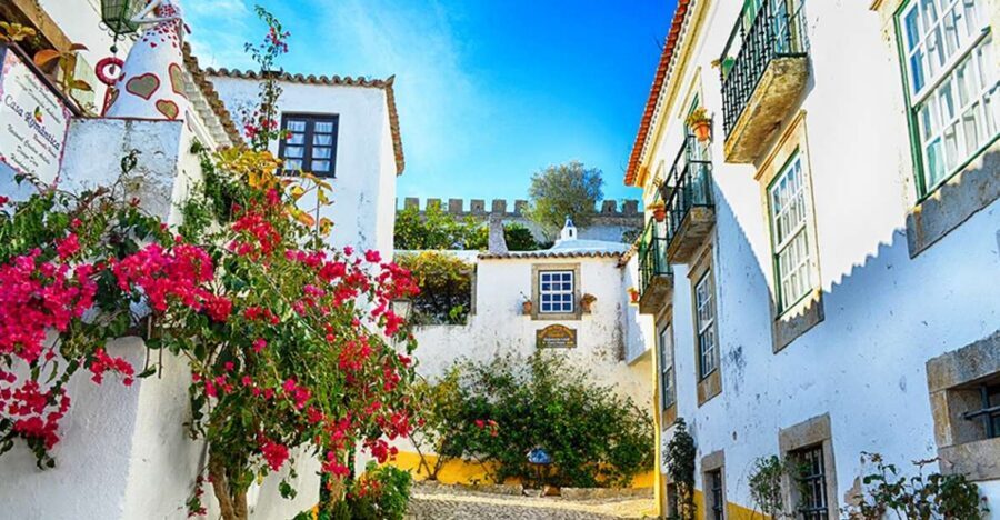 From Lisbon: Nazaré and Óbidos Private Tour in a premium car - Nazaré’s fishing-village views and the story of the 30-meter wave