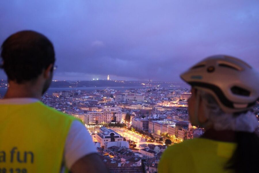 Go Lisbon by Night Electric Bike Tour - Riding Through Real Lisbon Streets: Comfort, Safety, and Pace