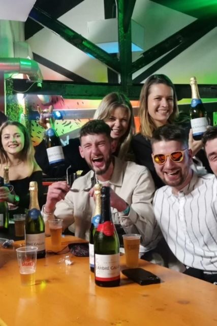 Halloween Haunts: Lisbon Pub Crawl Experience - Meeting at Camões Square: Timing, Umbrellas, and Dress Code