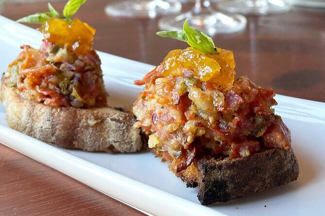 High-End Exclusive Food and Wine Tour Lisbon with a Winemaker - Palácio da Anunciada: octopus, cheeses, sausages, and aged Tawny Port