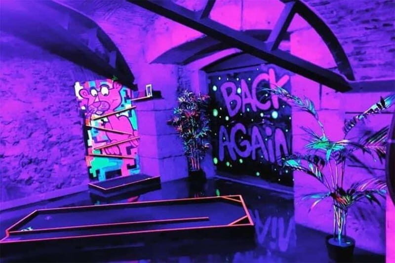 Lisbon: 18-Hole Indoor Minigolf Ticket with Bar Area - Two Lighting Styles: Natural Light Holes and UV Neon Fun