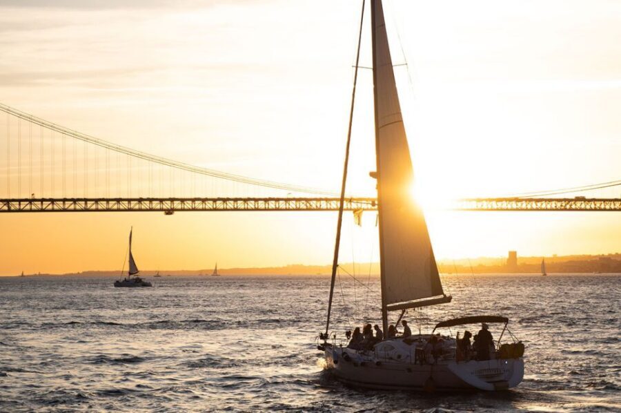 Lisbon: Alfama Charms, Tapas, Wine and Sunset Boat Cruise - Lisbon by water: the Tagus sunset sail (with wine in hand)