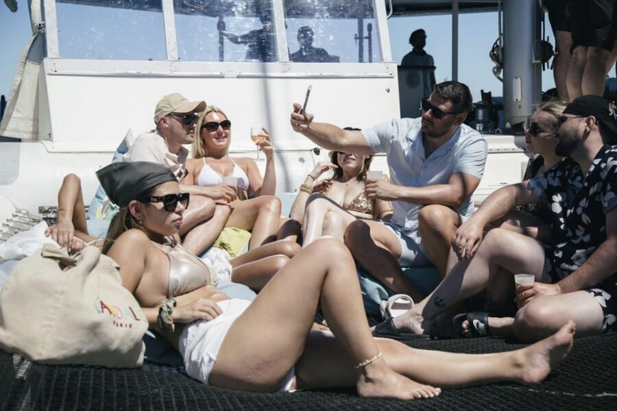 Lisbon: Catamaran Boat Party with Music, Open Bar & Dives - Swim Breaks With an Easy Ladder: Cooling Off Without Stress
