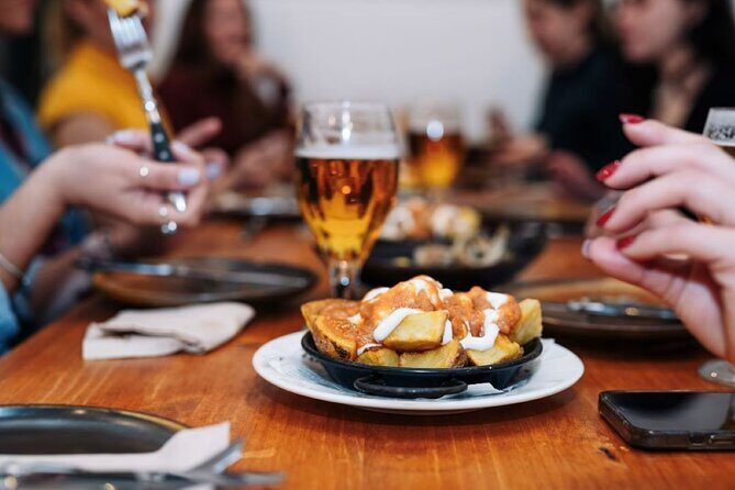 Lisbon Food Tour with Portuguese Wine: Taste the Best of Portugal - Start at Praça do Comércio and spot the Carpe Diem sign