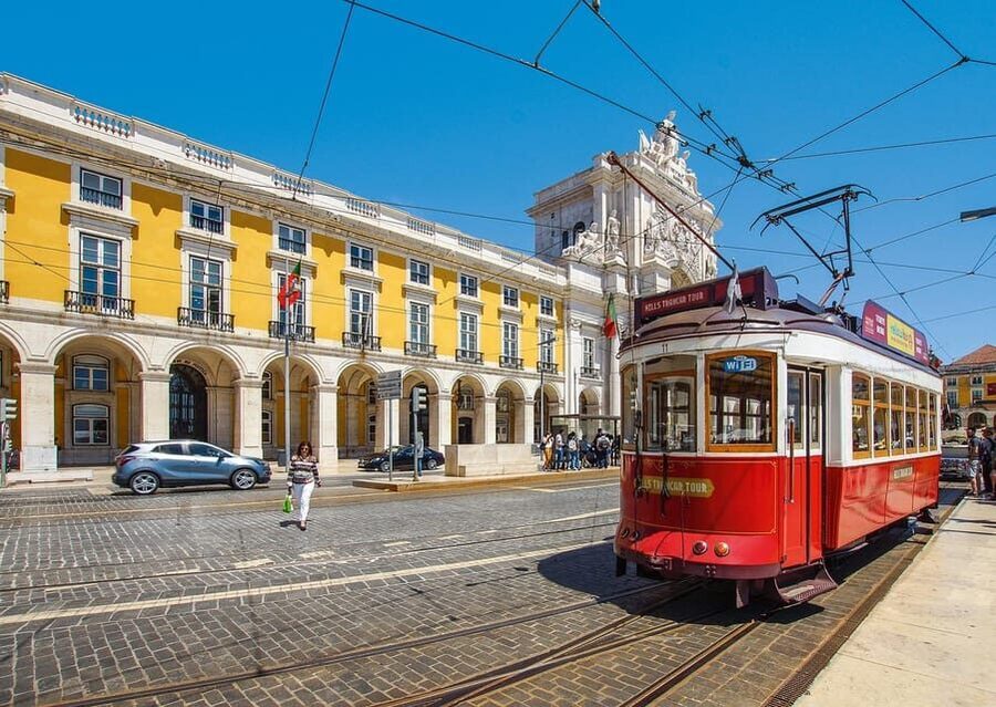 Lisbon: Guided Eco Tuk Tuk sightseeing tour - Rossio Square to Santa Justa Lift: a fast path through classic Lisbon