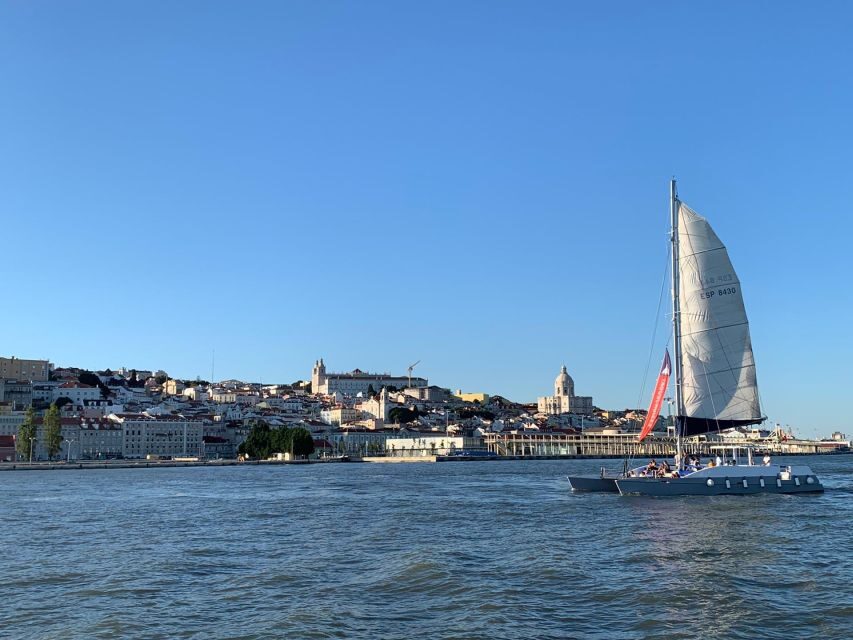 Lisbon: Private Catamaran Charter for up to 18-People - Under the 25th of April Bridge: Christ statue views without the crowd