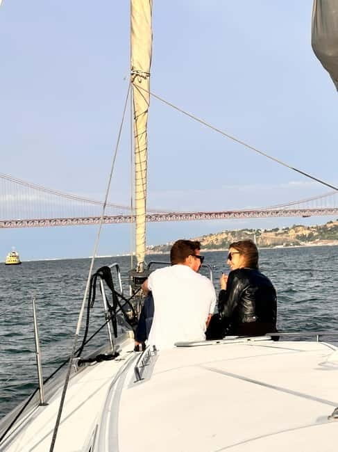 Lisbon: Romantic Cruise with Wine & Portuguese Tapas - Belém Tower and the riverfront photo run toward Discoveries