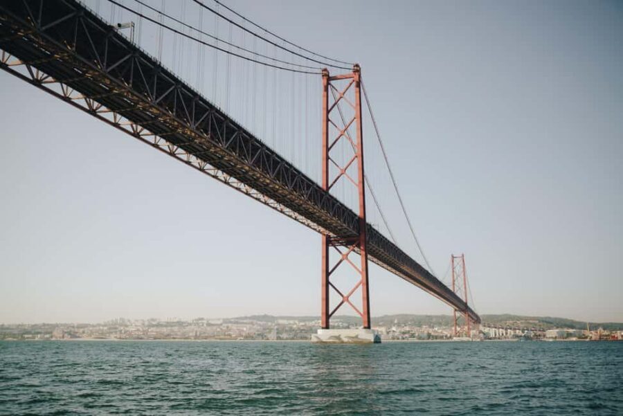 Lisbon Sunset Boat Tour with local Snacks & Drinks - The route: north-bank icons, south-bank working life