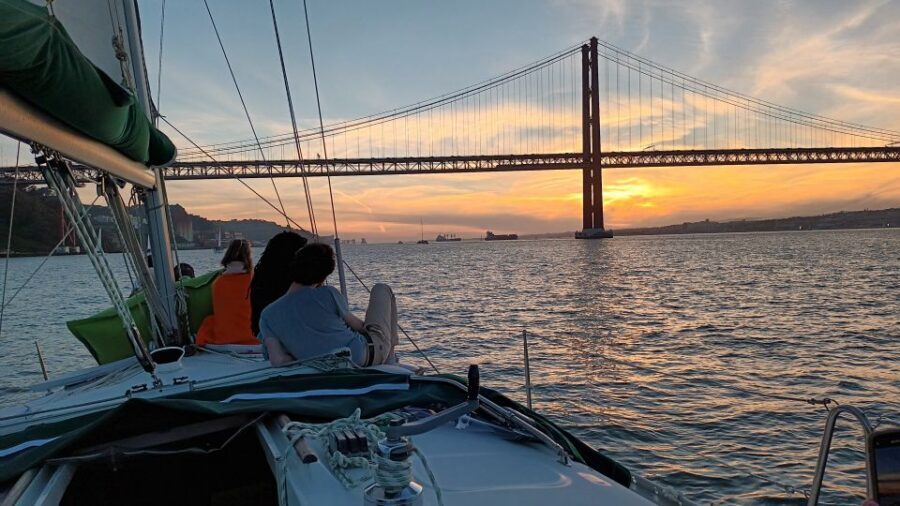 Lisbon: Sunset Cruise on The Tagus River with Welcome Drink - Christ the King and the south bank views through golden light