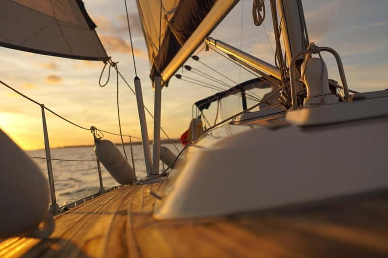 Lisbon: Sunset Sailing with Local Wine & Stunning Views - Bairro Alto, Chiado, and the center turning on its lights