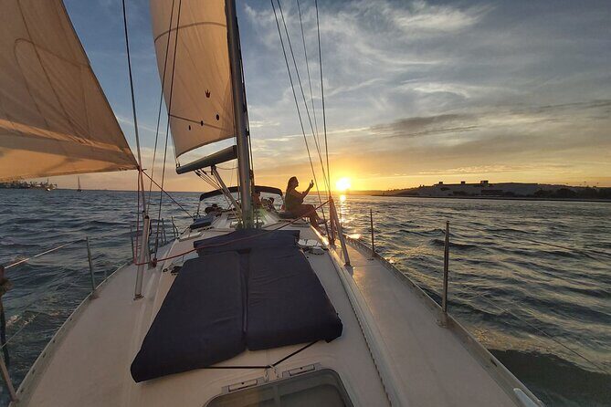 Lisbon Sunset Sailing with Portuguese Wine and History - The Tagus bridge-and-battlements view: 25th April Bridge to Christ the King