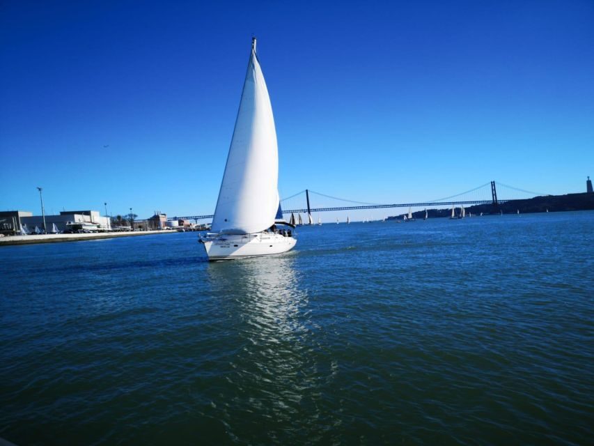 Lisbon: Yacht Sailing Tour With Portuguese Wine and History - 25 de Abril Bridge: the photo stop that sets the mood