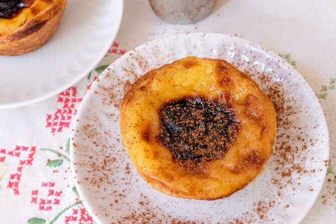 Market Tour, Cooking Class And Lunch At Mercado de Arroios - Lunch at the table: starters, stews, and Portuguese custard sweetness
