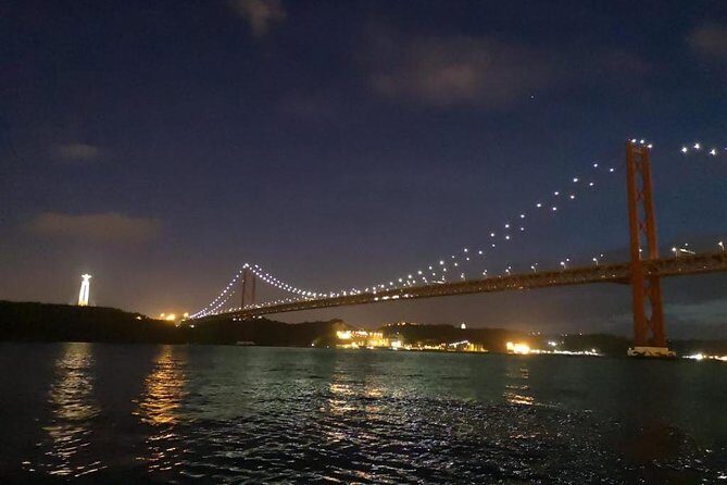 Passing the Year in a Boat with Champagne and Fireworks - Sailing Views: Cristo Rei and Ponte 25 de Abril at Night