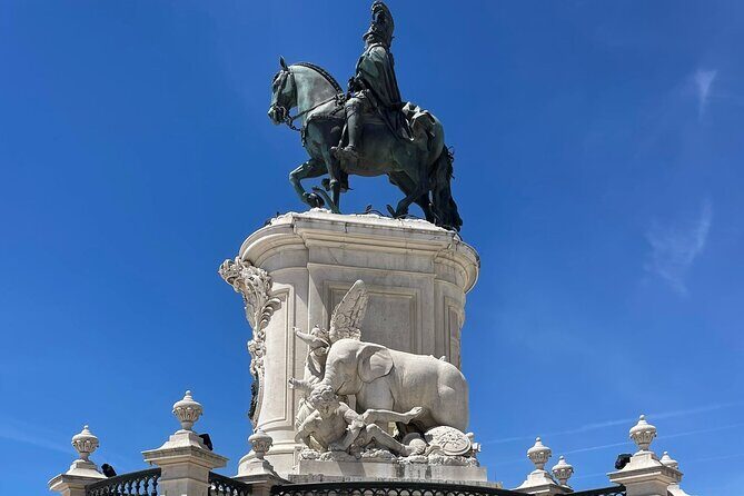 Private Guided Walking Tour in Lisbon - Praca Dom Pedro IV (Rossio Square): energy, fountains, and wave-pattern pavement
