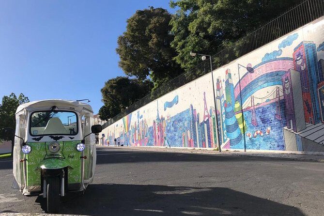 Tuk Tuk Lisbon: Exploring Urban Art - Vhils in Travessa das Merceeiras: When Street Art Looks Like Carving